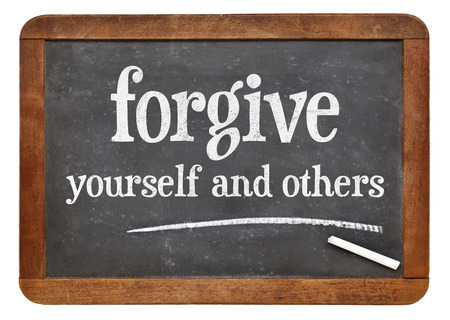 46177382 - forgive yourself and others advice - white chalk text n on a vintage slate blackboard